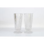 A pair of Art Deco cut glass vases, 27cm tall. Chips to both rims and feet.