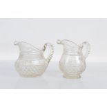 Two early 20th century cut glass jugs, 18cm and 17cm tall.