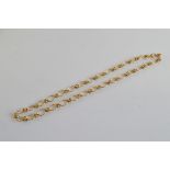 A 9ct gold fancy link knotted necklace, 44cm long. 25g