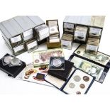 A collection of British and world coins, presented in two plastic hardware boxes, with pennies, half