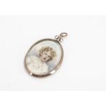 An Edwardian portrait miniature oval pendant, with open back revealing lock of hair, portrait of a