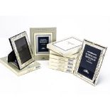 A collection of thirty three modern silver plated photograph frames, each boxed, 19 with internal