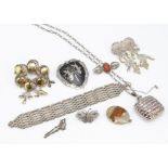 A quantity of silver jewellery, including a gate bar bracelet, coral and silver brooches,