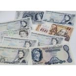 Eight British £5 notes, together with a Central Bank of Ireland £5, four from Gill, an O'Brien, a