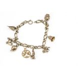 A 9ct gold curb link charm bracelet, with seven 9ct gold charms and one 18ct gold Maltese cross,