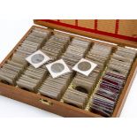 A collection of British Coins, presented in a Boots slide case, each coin in plastic sleeve, some