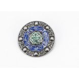 A silver and enamel Celtic brooch, in the manner of Alexander Ritchie, 3.7cm diameter, 15.2g