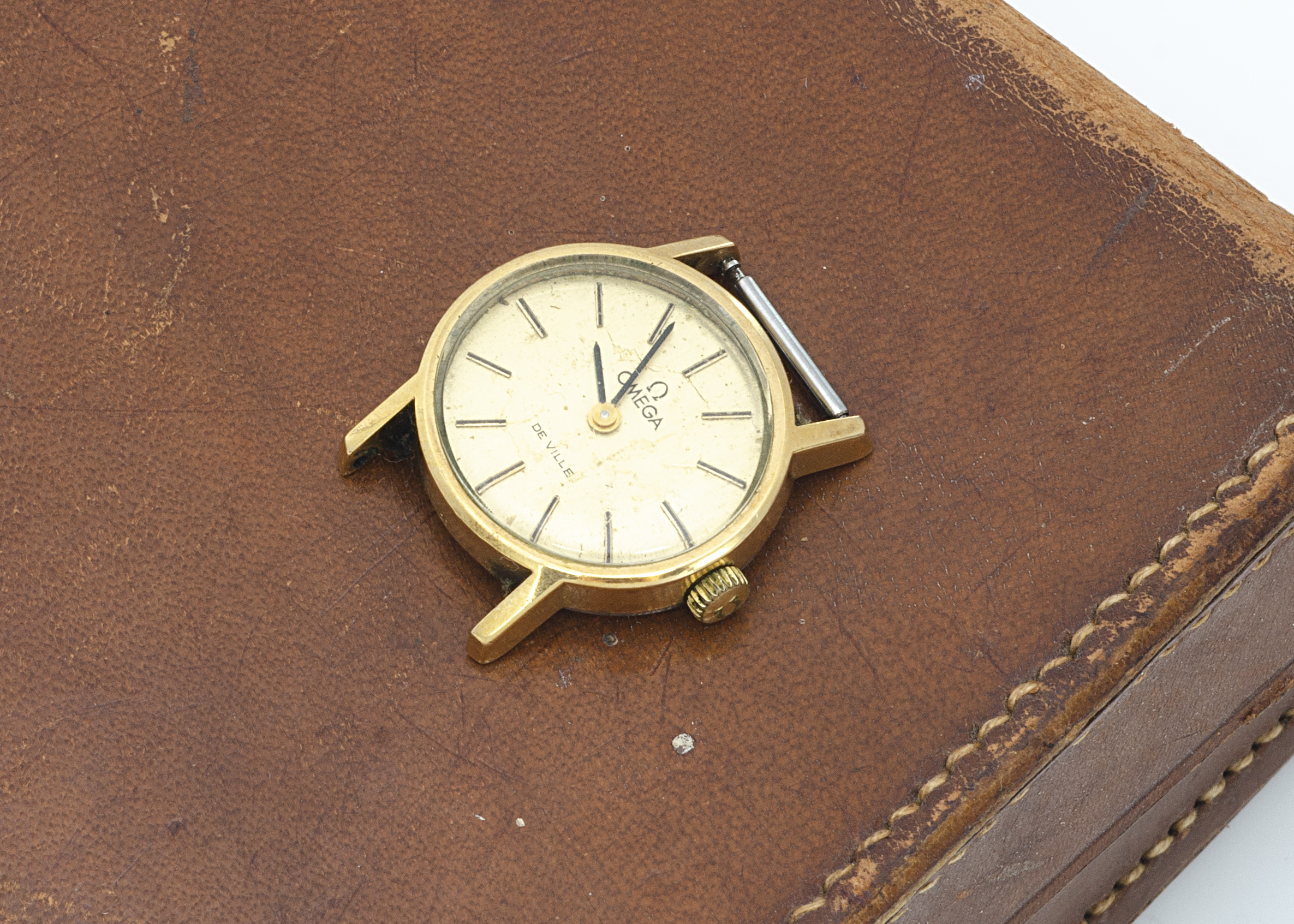 A c1970s Omega De Ville lady's wristwatch head, 19mm, oval, gilt dial with batons, gold plated to