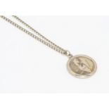 A 9ct gold Star of David and Map of Israel gentleman's medallion, on a curb link 9ct gold chain,