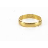 A yellow metal plain wedding band, ring size T 1/2, 4.6g