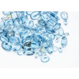 A quantity of loose blue topaz gem stones, varying cuts from oval to pear, baguette and round, 590ct