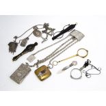 A Victorian silver muff chain, mounted with a silver vinaigrette, mesh purse and other items,