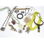 A quantity of costume jewellery, including a paste set Art Deco white metal pendant and locket,