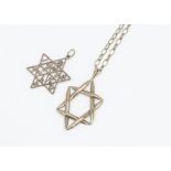 Two 9ct gold Star of David pendants, one with textured and smooth decoration, the other of pierced