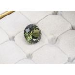 A certificated natural non heat treated green sapphire, round cut 11.81ct, with GCS report number