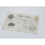 A 1950s British white £5 bank note, cashier Beale, dated June 1952, X99 088774, some creasing,