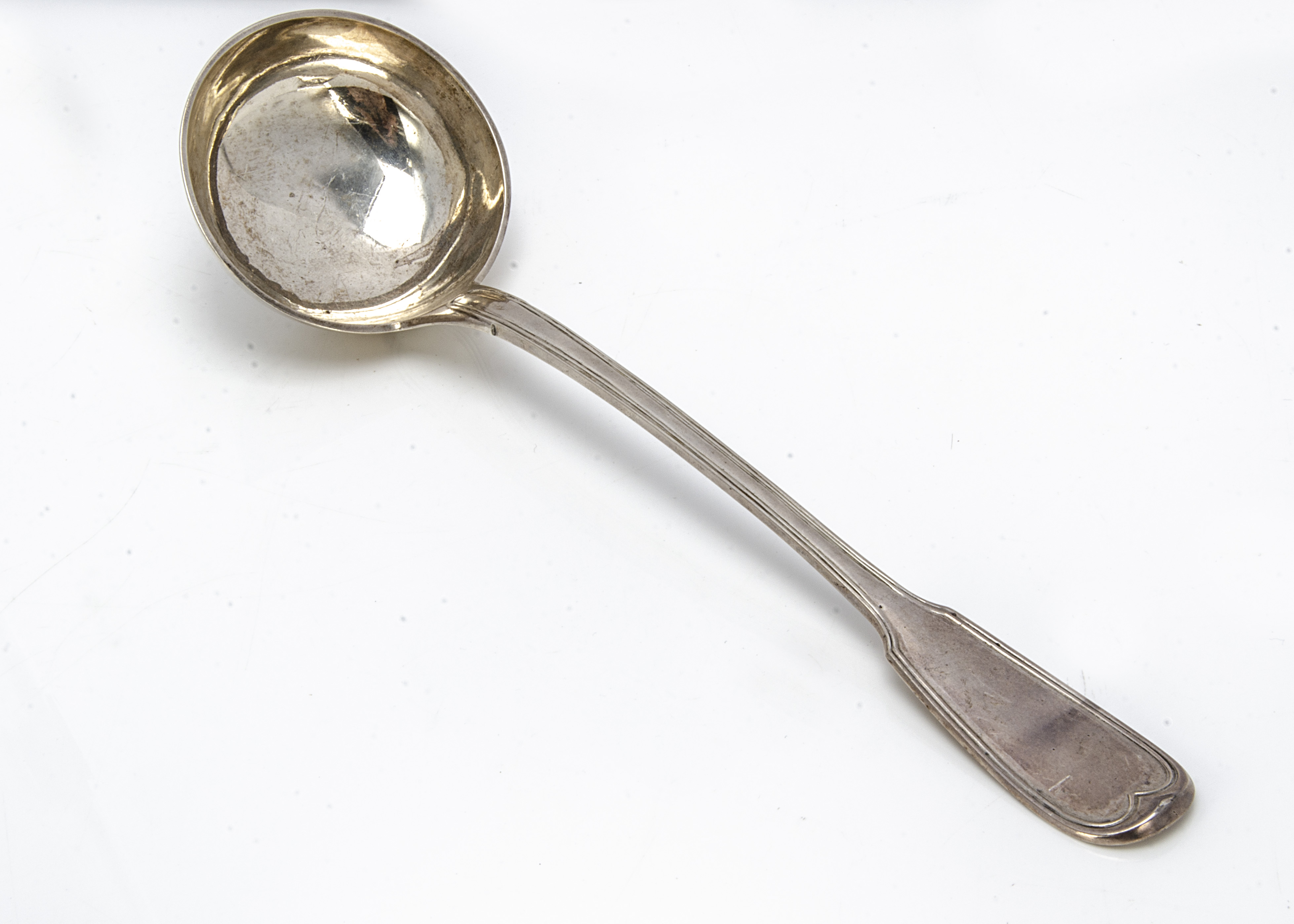 A late 19th century French white metal soup ladle, 34cm, 9.15 ozt, fiddle and thread style pattern