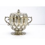 A George V silver twin handled cup and cover from Mappin & Webb, the lobed shaped footed base with