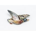 A Royal Worcester porcelain duck brooch, painted in colours with printed factory mark to reverse,