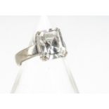 An 18ct white gold zircon dress ring, with baguette cut claw set colourless zircon, in thick white