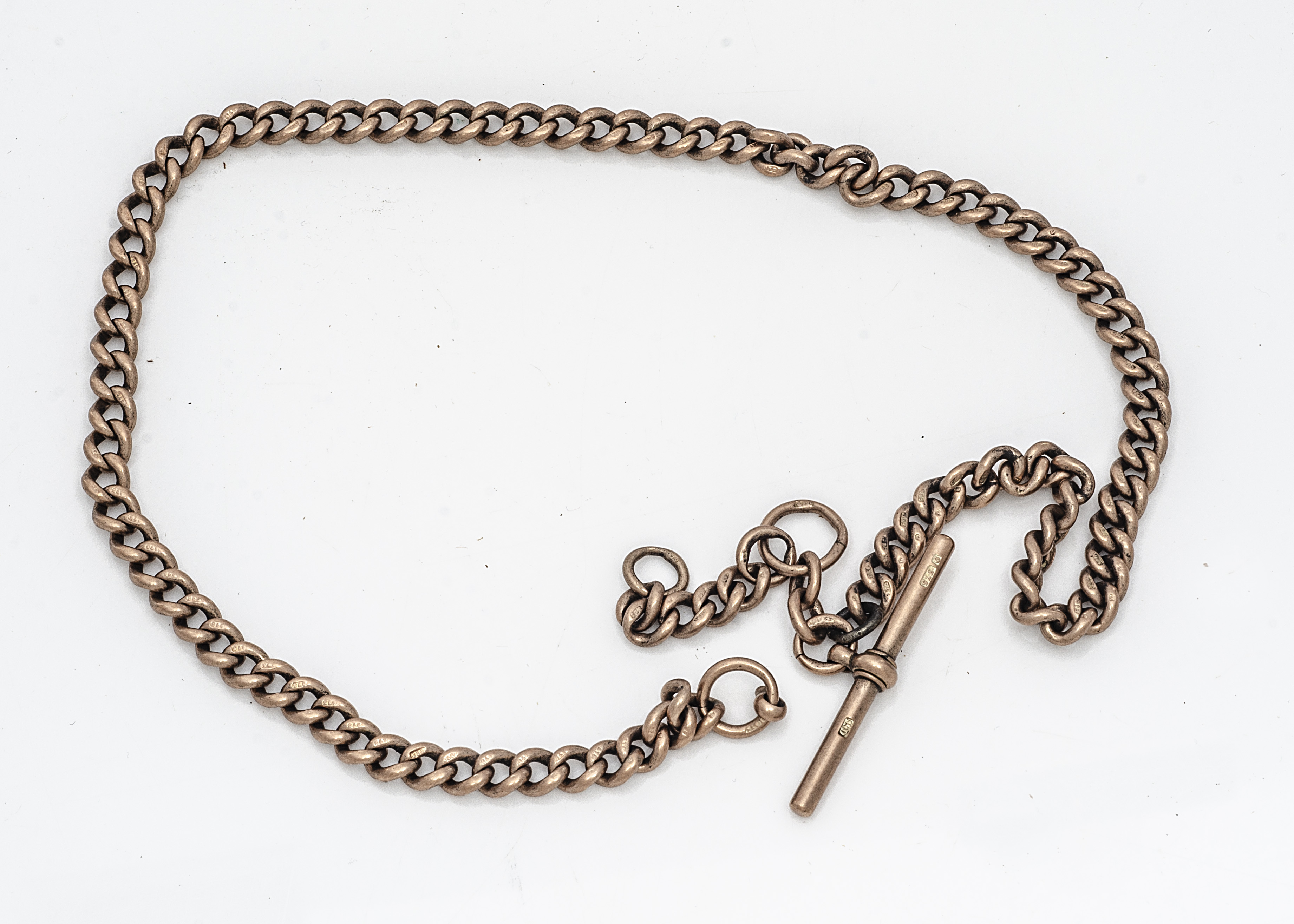 A late Victorian or Edwardian 9ct gold pocket watch chain, hallmarked curb link chain with T bar,