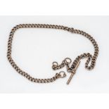 A late Victorian or Edwardian 9ct gold pocket watch chain, hallmarked curb link chain with T bar,