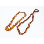 Two strings of Baltic translucent amber pebble beads, 140g