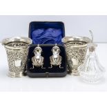 A pair of late Victorian silver peppers in case, together with a pair of silver filled pierced vases