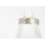 A 22ct gold and platinum herringbone flat shaped wedding band, ring size O, 5.3mm, 5.1g