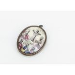 A continental 19th Century enamel and base metal oval religious pendant, with a painted scene of the