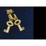 A pair of Theo Fennell 18c gold and diamond drop earrings, in the form of keys, 2.9cm drop, 7.2g