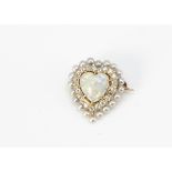 An opal, diamond and seed pearl heart shaped brooch, the heart cut precious opal surrounded by