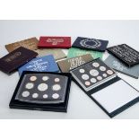 A collection of United Kingdom Royal Mint proof sets, from the 1970s through to the early 2000s,