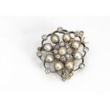 An early 20th Century diamond and seed pearl flower head brooch or pendant, with screw off