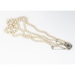 A double row of graduated knotted strung cultured pearls, with 9ct gold turquoise and pearl clasp,