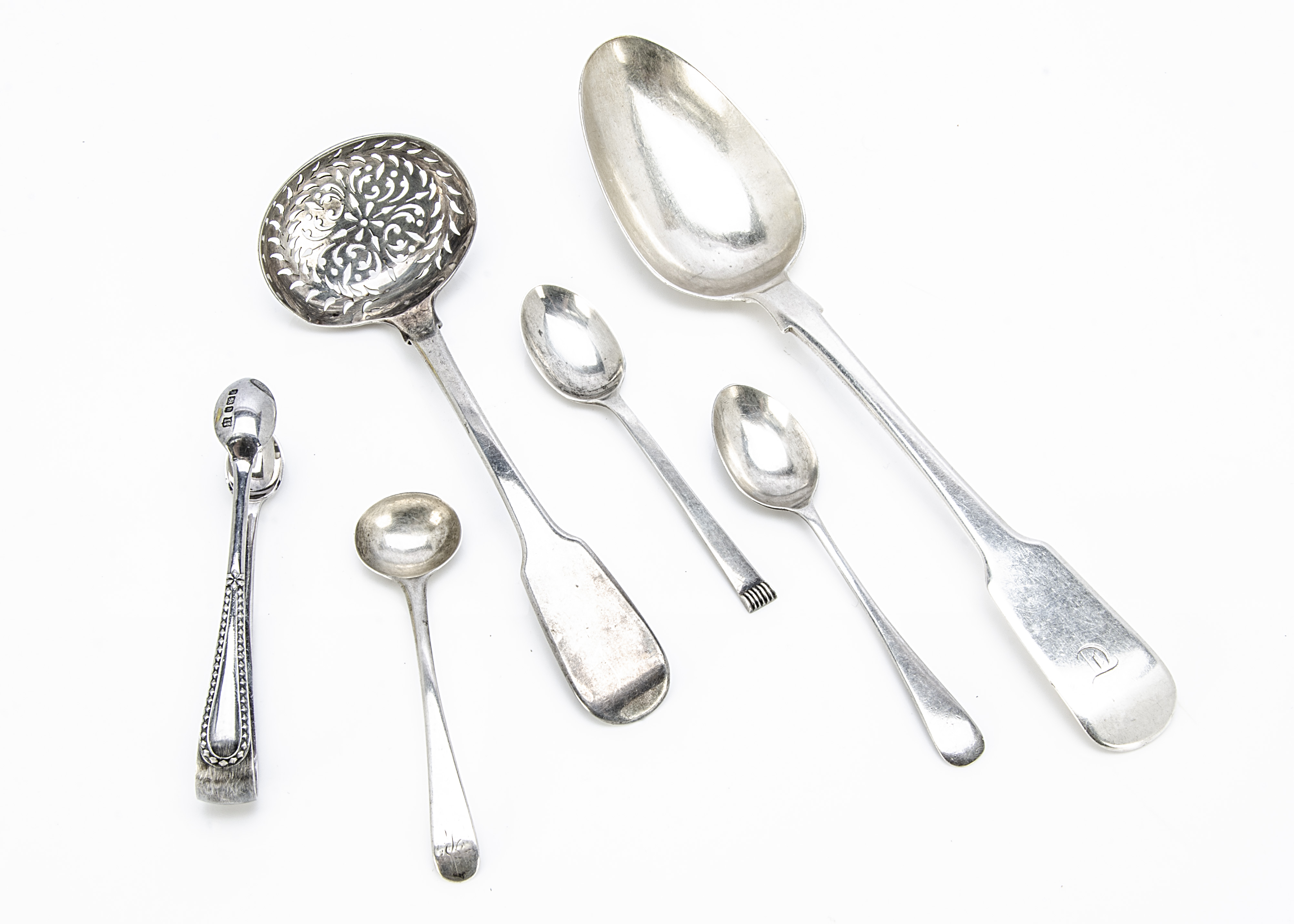A late Georgian silver tablespoon, together with a silver sifter spoon, tongs and three small