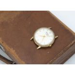 A 1970 J.W. Benson 9ct gold gentleman's wristwatch head, 34mm, silvered dial, manual wind, appears