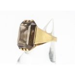 A continental 18ct gold smoky quartz cocktail ring, marked Justa, the baguette cut smoky quartz in