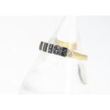 An 18ct gold sapphire and diamond half hoop dress ring, the square cut sapphires in channel paired