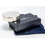 A modern sterling silver box from Aquascutum, 8.5cm diameter, 5 ozt, with blue velvet lining, with