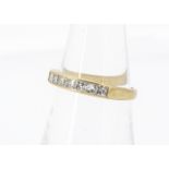 A channel set princess cut seven stone 18ct gold dress ring, ring size M, 2.7g