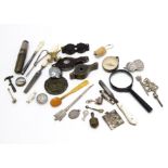 A group of small collectable items, including a miniature fob garden roller and hammer, a silver ARP