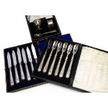 A silver three piece christening set in box, together with a set of six silver handled butter knives