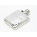 A George V small silver hip flask, 11.5cm high, 3.4ozt, some dents
