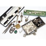 A quantity of silver jewellery, including charm bracelets, rings, silver pill box, watches and other