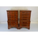 A pair of mahogany reproduction miniature chests on chests, having two short over three long drawers