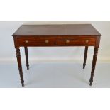 A Victorian mahogany side table, having two drawers with brass ring handles, turned supports.