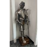 A 16th Century and later suit of armour, the close helmet with pronounced visor of Spanish