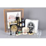 A large collection of Guinness memorabilia, comprising numerous bottle with various designs,