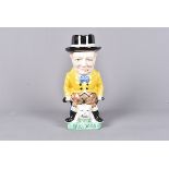 A Burleigh Ware cream glazed Toby Jug by John Bull, the Churchill jug with him astride a Bulldog